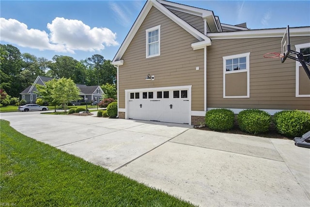 2408 Mathews Green Rd, Virginia Beach, VA 23456 - view of home's exterior featuring a garage and concrete driveway