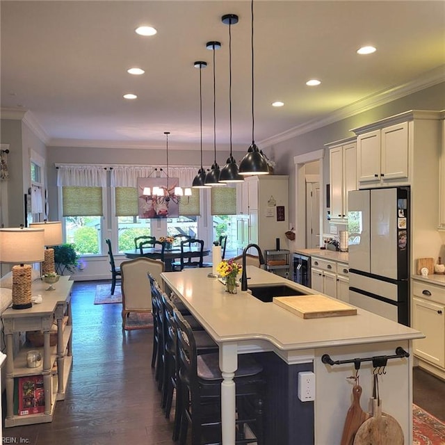 2408 Mathews Green Rd, Virginia Beach, VA 23456 - kitchen featuring freestanding refrigerator, a sink, recessed lighting, light countertops, and white cabinetry