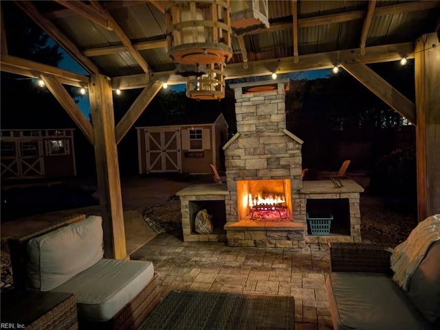 2408 Mathews Green Rd, Virginia Beach, VA 23456 - patio at night with a fireplace and a patio area