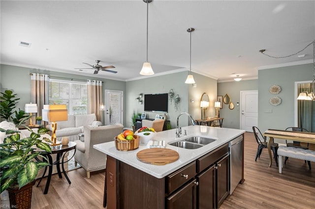 1720 Vankar Dr, Virginia Beach, VA 23456 - kitchen with a sink, stainless steel dishwasher, light countertops, dark brown cabinets, and light wood-type flooring