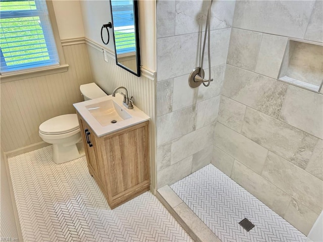 1813 Jack Frost Rd, Virginia Beach, VA 23455 - full bathroom featuring toilet, a tile shower, vanity, and a wainscoted wall