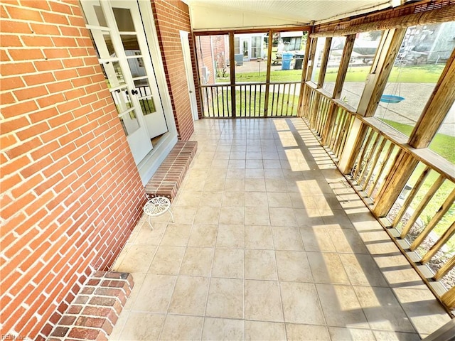 1813 Jack Frost Rd, Virginia Beach, VA 23455 - unfurnished sunroom with lofted ceiling, plenty of natural light, and french doors