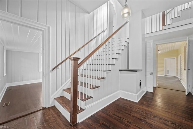 221 Homestead Rd, Franklin, VA 23851 - staircase with hardwood / wood-style floors, a decorative wall, and baseboards