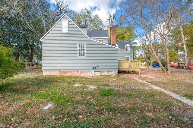 221 Homestead Rd, Franklin, VA 23851 - view of side of home featuring a wooden deck, a chimney, crawl space, and a yard