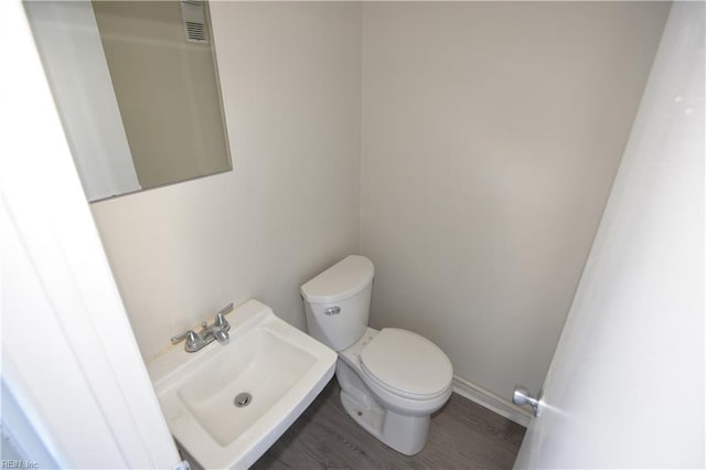 3861 Chancery Ln, Virginia Beach, VA 23452 - bathroom featuring a sink, toilet, and wood finished floors
