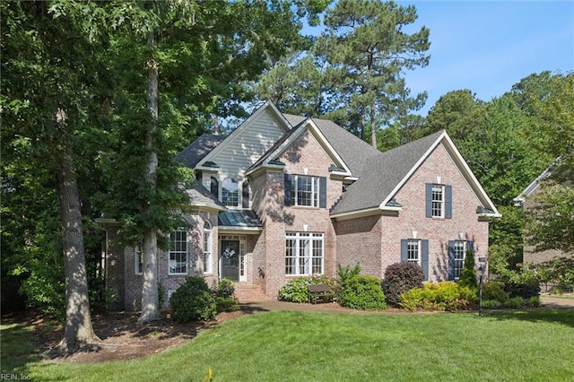 20524 Creekside Dr, Smithfield, VA 23430 - view of front facade with brick siding and a front lawn