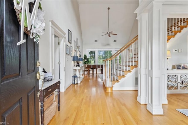20524 Creekside Dr, Smithfield, VA 23430 - foyer with decorative columns, stairs, wood finished floors, a high ceiling, and a ceiling fan
