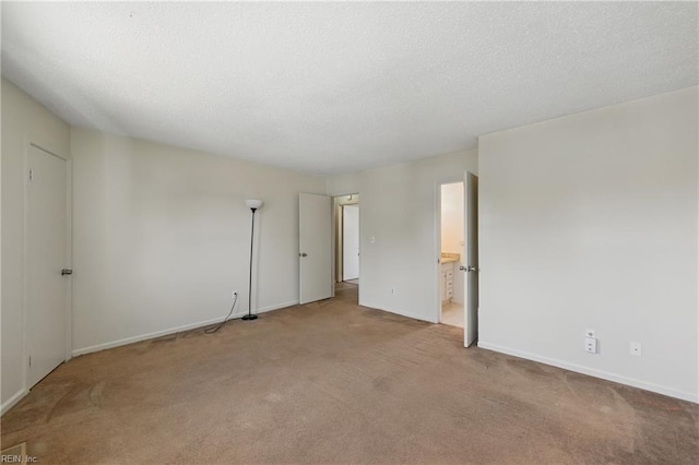 3531 Woodburne Dr, Virginia Beach, VA 23452 - empty room featuring carpet, baseboards, and a textured ceiling