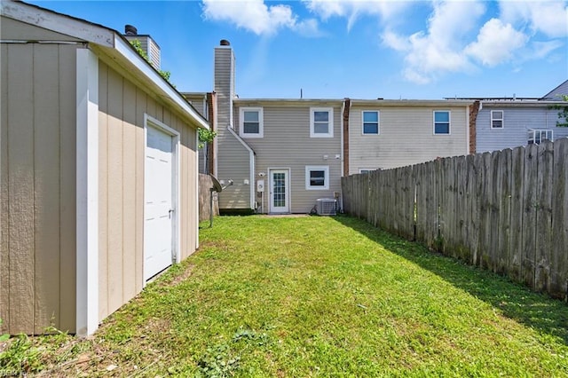 3531 Woodburne Dr, Virginia Beach, VA 23452 - rear view of house featuring central AC, a garage, and a chimney