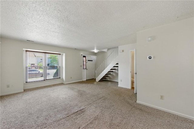 3531 Woodburne Dr, Virginia Beach, VA 23452 - unfurnished living room featuring stairs, carpet, a textured ceiling, and baseboards