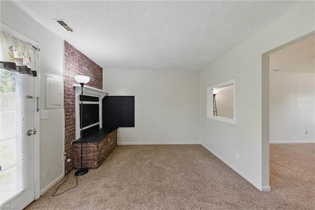 3531 Woodburne Dr, Virginia Beach, VA 23452 - unfurnished living room with carpet, a textured ceiling, a brick fireplace, electric panel, and baseboards