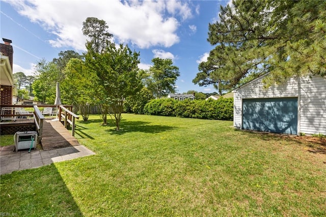 4422 Gannon Rd, Portsmouth, VA 23703 - view of green lawn featuring an outdoor structure and a deck