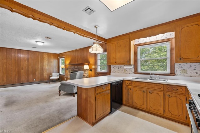 4422 Gannon Rd, Portsmouth, VA 23703 - kitchen featuring dishwasher, brown cabinets, a sink, a peninsula, and wood walls