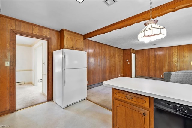 4422 Gannon Rd, Portsmouth, VA 23703 - kitchen featuring freestanding refrigerator, dishwasher, wooden walls, brown cabinets, and light colored carpet