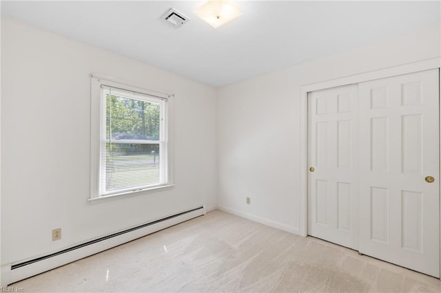4422 Gannon Rd, Portsmouth, VA 23703 - unfurnished bedroom featuring baseboard heating, carpet, a closet, and baseboards