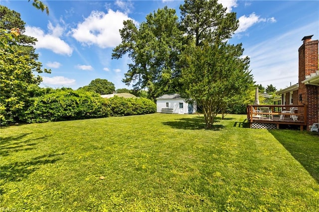 4422 Gannon Rd, Portsmouth, VA 23703 - view of green lawn with a deck and an outbuilding
