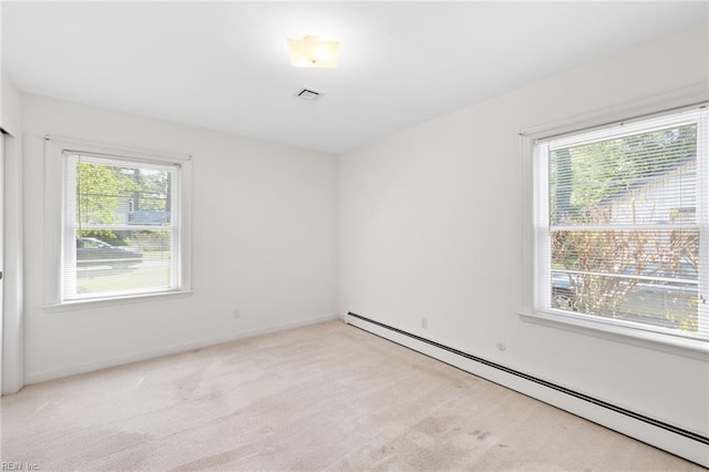 4422 Gannon Rd, Portsmouth, VA 23703 - empty room with a baseboard radiator, light colored carpet, and baseboards