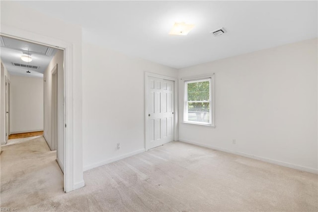 4422 Gannon Rd, Portsmouth, VA 23703 - unfurnished bedroom with attic access, carpet flooring, baseboards, and a closet