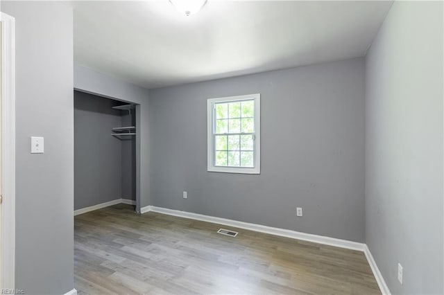 624 Highland Ct, Newport News, VA 23605 - unfurnished bedroom with wood finished floors, baseboards, and a closet