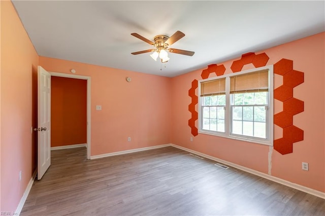 624 Highland Ct, Newport News, VA 23605 - empty room featuring a ceiling fan, wood finished floors, and baseboards