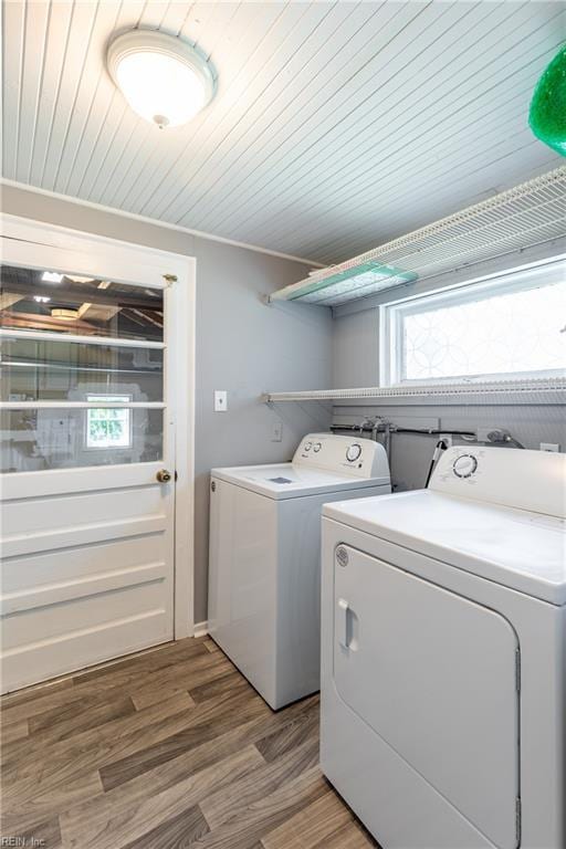 624 Highland Ct, Newport News, VA 23605 - laundry area featuring washing machine and clothes dryer, light wood finished floors, and wooden ceiling