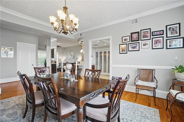 910 Greenway Ct Unit 8, Norfolk, VA 23507 - dining space with a chandelier, wood finished floors, and baseboards