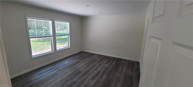 175 Pinto Dr, Moyock, NC 27958 - empty room featuring crown molding, dark wood-style flooring, and baseboards