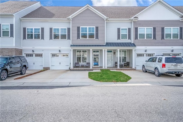 316 Sikeston Ln, Chesapeake, VA 23322 - multi unit property featuring driveway, covered porch, a garage, a shingled roof, and a standing seam roof