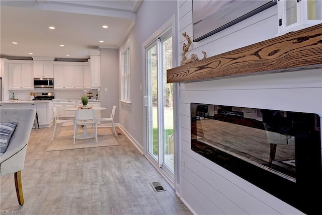 718C Poquoson Ave, Poquoson, VA 23662 - dining space featuring recessed lighting, baseboards, light wood finished floors, and crown molding