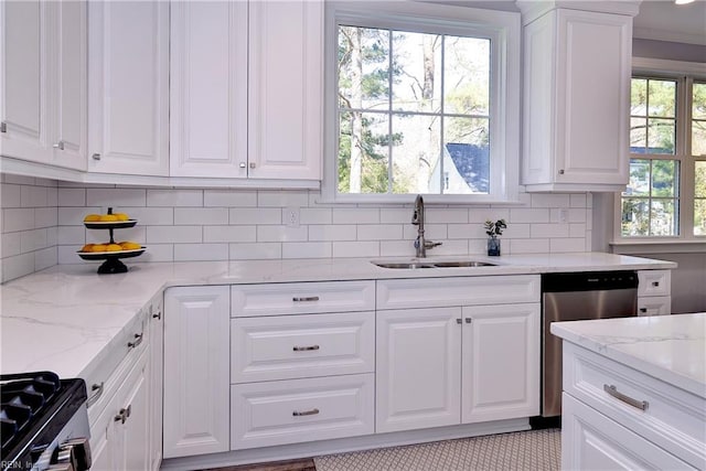 718C Poquoson Ave, Poquoson, VA 23662 - kitchen featuring a sink, stainless steel appliances, white cabinetry, and decorative backsplash