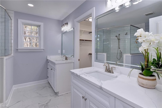 718C Poquoson Ave, Poquoson, VA 23662 - full bathroom featuring a shower stall, two vanities, baseboards, marble finish floors, and recessed lighting