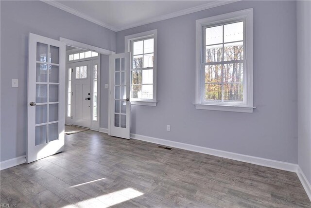 718C Poquoson Ave, Poquoson, VA 23662 - entryway with ornamental molding, baseboards, french doors, and wood finished floors