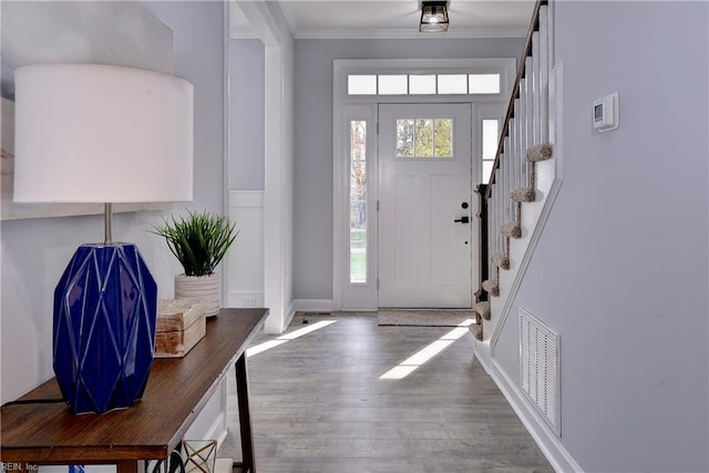 718C Poquoson Ave, Poquoson, VA 23662 - foyer with stairs, wood finished floors, crown molding, and baseboards