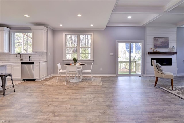 718C Poquoson Ave, Poquoson, VA 23662 - kitchen featuring stainless steel dishwasher, open floor plan, light countertops, recessed lighting, and ornamental molding