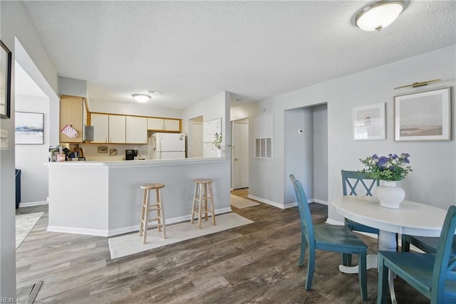 5165 Thatcher Way, Virginia Beach, VA 23456 - dining room with a textured ceiling, wood finished floors, and baseboards