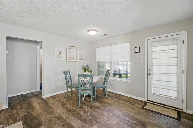 5165 Thatcher Way, Virginia Beach, VA 23456 - dining room with wood finished floors, baseboards, and a textured ceiling