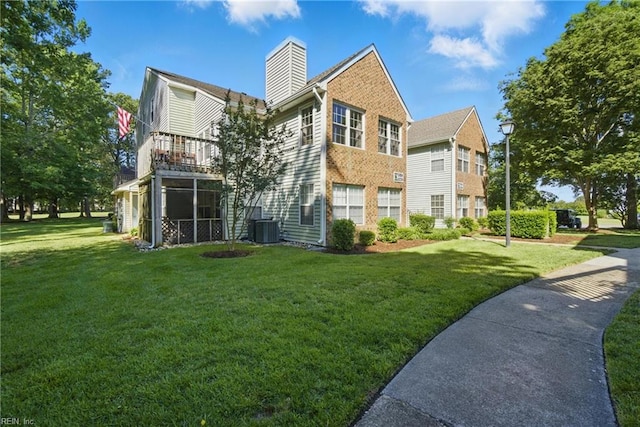 5165 Thatcher Way, Virginia Beach, VA 23456 - rear view of house with a chimney, central AC unit, a yard, and a balcony