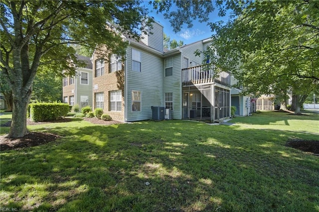 5165 Thatcher Way, Virginia Beach, VA 23456 - back of house featuring a sunroom, a lawn, central AC unit, and a chimney