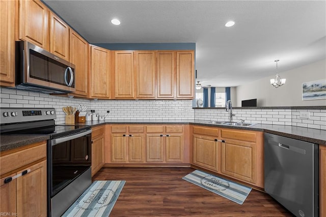 264 Feldspar St, Virginia Beach, VA 23462 - kitchen with appliances with stainless steel finishes, a sink, backsplash, dark wood finished floors, and recessed lighting