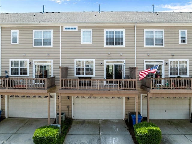 264 Feldspar St, Virginia Beach, VA 23462 - rear view of property with a garage and driveway