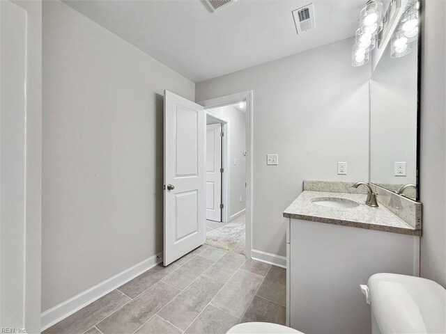 206 Loon Ct, Newport News, VA 23606 - bathroom with vanity, toilet, and baseboards