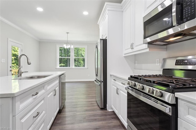 206 Loon Ct, Newport News, VA 23606 - kitchen featuring stainless steel appliances, a sink, white cabinets, light countertops, and crown molding