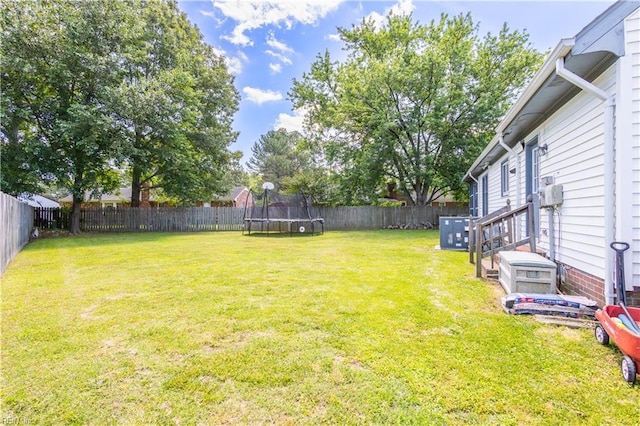 2668 N Elizabeth Harbor Dr, Chesapeake, VA 23321 - view of yard featuring a trampoline and central AC unit