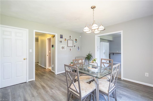 2668 N Elizabeth Harbor Dr, Chesapeake, VA 23321 - dining space with a chandelier, wood finished floors, and baseboards