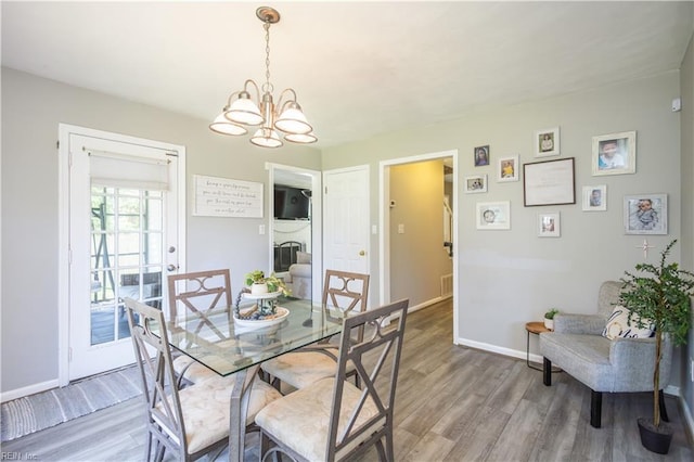 2668 N Elizabeth Harbor Dr, Chesapeake, VA 23321 - dining space featuring light wood-style flooring, a chandelier, and baseboards