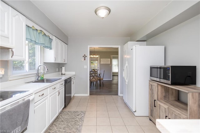 2668 N Elizabeth Harbor Dr, Chesapeake, VA 23321 - kitchen with white appliances, a sink, a chandelier, and plenty of natural light