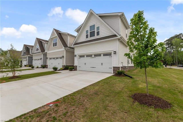 23050 Preserve Pl, Carrollton, VA 23314 - view of front of property with an attached garage, driveway, a front yard, and stone siding