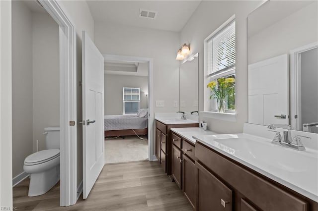 23050 Preserve Pl, Carrollton, VA 23314 - ensuite bathroom featuring wood finished floors, vanity, and toilet