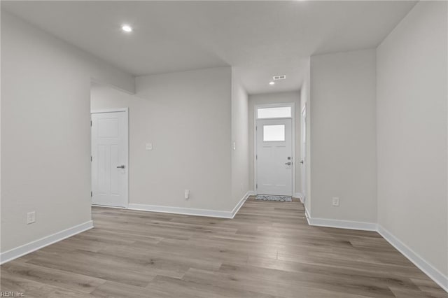 23050 Preserve Pl, Carrollton, VA 23314 - foyer entrance featuring light wood-style floors, baseboards, and recessed lighting