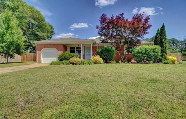 529 Warren Ave, Chesapeake, VA 23322 - view of front facade featuring an attached garage, concrete driveway, and brick siding